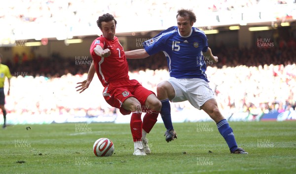 28.03.09 - Wales v Finland, FIFA World Cup 2010 Qualifying Group 4 -  Wales' Simon Davies Finland's Markus Heikkinen  