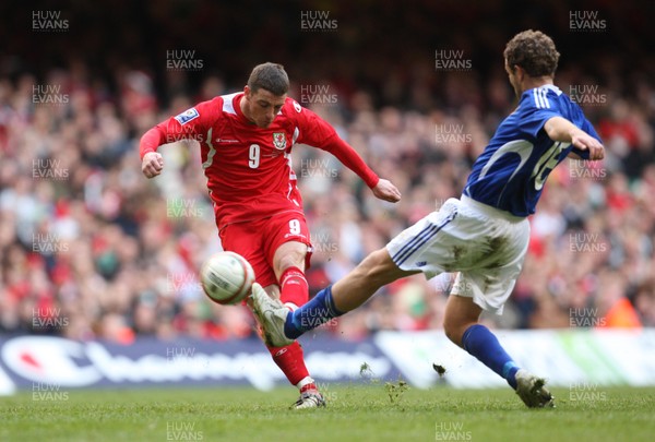 28.03.09 - Wales v Finland, FIFA World Cup 2010 Qualifying Group 4 -  Wales' Jason Koumas fires a shot at goal as Finland's Jonatan Johansson closes in 