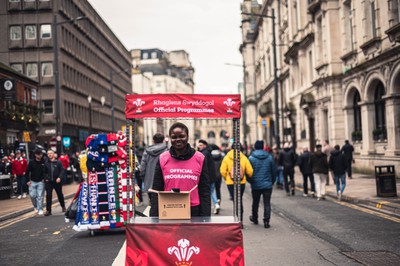 100324 - Wales v France - Guinness Six Nations - Program Seller  ahead of the game 