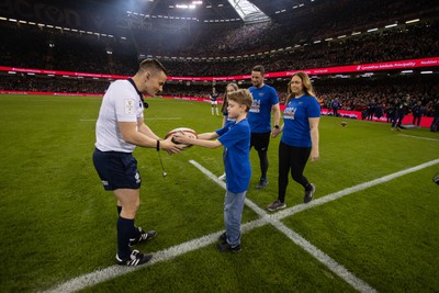 100324 - Wales v France - Guinness 6 Nations Championship - Craig Maxwell and family deliver the match ball