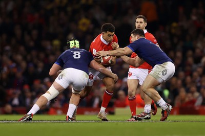 100324 - Wales v France - Guinness 6 Nations Championship - Rio Dyer of Wales is tackled by Gregory Alldritt and Julien Marchand of France 