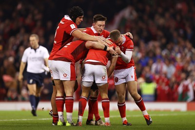 100324 - Wales v France - Guinness 6 Nations Championship - Rio Dyer of Wales celebrates scoring a try with team mates