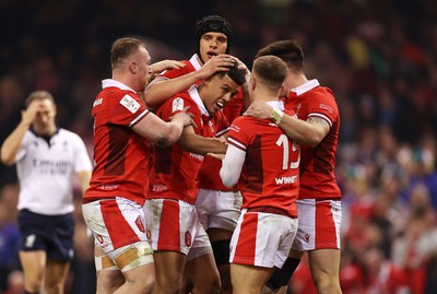 100324 - Wales v France - Guinness 6 Nations Championship - Rio Dyer of Wales celebrates scoring a try with team mates