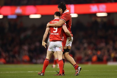 100324 - Wales v France - Guinness 6 Nations Championship - Tomos Williams of Wales celebrates scoring a try with Dafydd Jenkins