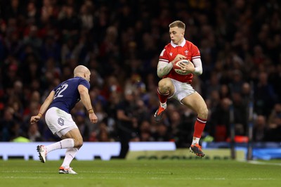 100324 - Wales v France - Guinness 6 Nations Championship - Cameron Winnett of Wales is challenged by Maxime Lucu of France 