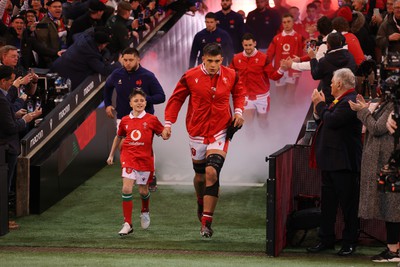 100324 - Wales v France - Guinness 6 Nations Championship - Dafydd Jenkins of Wales with mascot