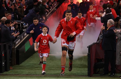 100324 - Wales v France - Guinness 6 Nations Championship - Dafydd Jenkins of Wales with mascot