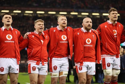 100324 - Wales v France - Guinness 6 Nations Championship - Joe Roberts, Sam Costelow, Tommy Reffell and Dillon Lewis of Wales sing the anthem