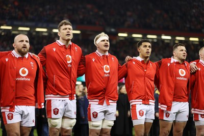 100324 - Wales v France - Guinness 6 Nations Championship - Dillon Lewis, Will Rowlands, Aaron Wainwright, Rio Dyer and Ellot Dee of Wales sing the anthem