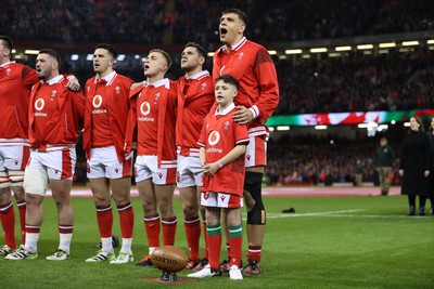 100324 - Wales v France - Guinness 6 Nations Championship - Dafydd Jenkins of Wales sings the anthem