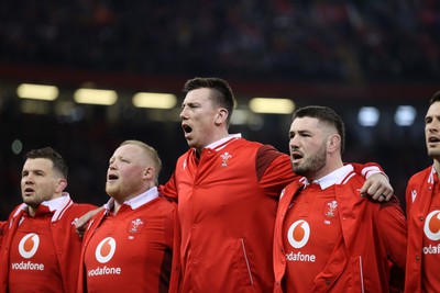 100324 - Wales v France - Guinness 6 Nations Championship - Adam Beard of Wales sings the anthem