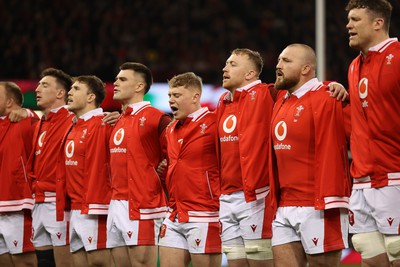 100324 - Wales v France - Guinness 6 Nations Championship - Sam Costelow of Wales sings the anthem