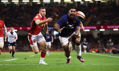 100324 - Wales v France Guinness 6 Nations - Romain Taofifenua of France beats Gareth Davies of Wales to score try