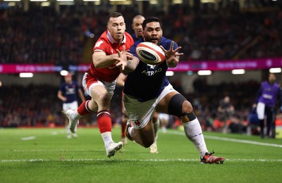 100324 - Wales v France Guinness 6 Nations - Romain Taofifenua of France beats Gareth Davies of Wales to score try