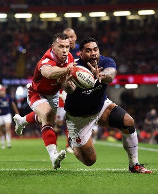 100324 - Wales v France Guinness 6 Nations - Romain Taofifenua of France beats Gareth Davies of Wales to score try