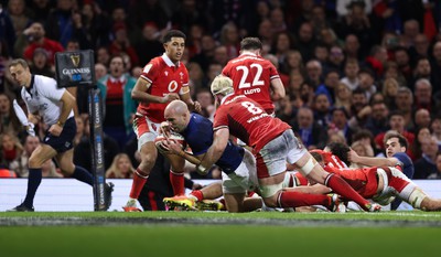 100324 - Wales v France Guinness 6 Nations - Maxime Lucu of France beats Aaron Wainwright of Wales to score try