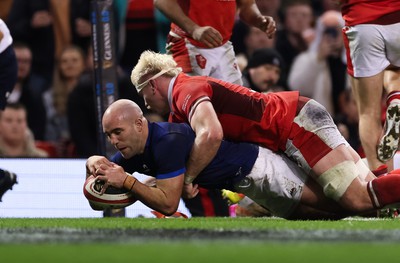 100324 - Wales v France Guinness 6 Nations - Maxime Lucu of France beats Aaron Wainwright of Wales to score try