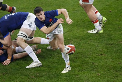 100324 - Wales v France - Guinness Six Nations - Nolann Le Garrec of France passes the ball