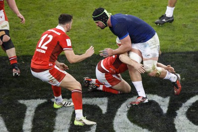 100324 - Wales v France - Guinness Six Nations - Gregory Alldritt of France takes on Owen Watkin of Wales