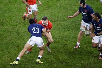 100324 - Wales v France - Guinness Six Nations - Mason Grady of Wales is tackled by Yoram Moefana of France