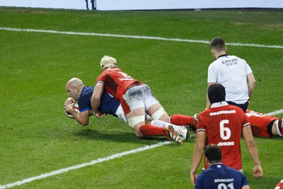 100324 - Wales v France - Guinness Six Nations - Maxime Lucu of France scores a try