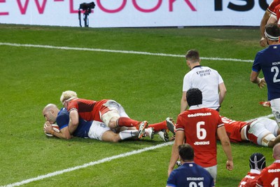 100324 - Wales v France - Guinness Six Nations - Maxime Lucu of France scores a try