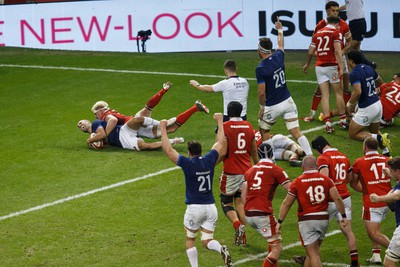 100324 - Wales v France - Guinness Six Nations - Maxime Lucu of France scores a try