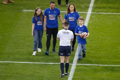 100324 - Wales v France - Guinness Six Nations - Craig Maxwell and family deliver the match ball to Referee Luke Pearce