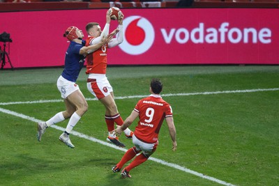 100324 - Wales v France - Guinness Six Nations - Cameron Winnett of Wales competes with Louis Bielle Biarrey of France for the ball near the Wales try line