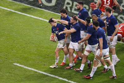 100324 - Wales v France - Guinness Six Nations - France congratulate Nolann Le Garrec of France after he scores a try