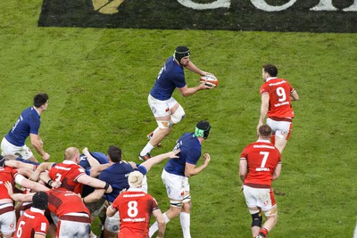 100324 - Wales v France - Guinness Six Nations - Gregory Alldritt of France runs at Tomos Williams of Wales