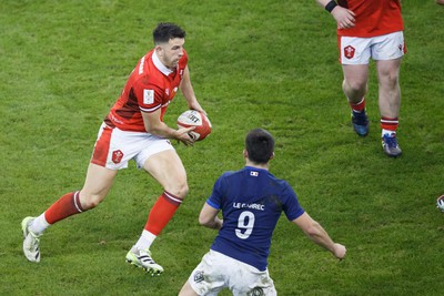 100324 - Wales v France - Guinness Six Nations - Owen Watkin of Wales runs at the defence