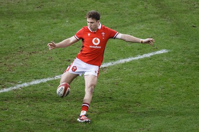 100324 - Wales v France - Guinness Six Nations - Ioan Lloyd of Wales kicks the ball