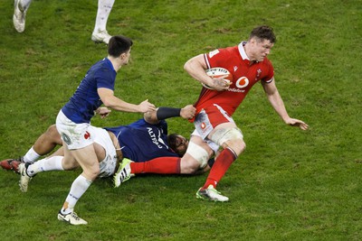 100324 - Wales v France - Guinness Six Nations - Will Rowlands of Wales is tackled by Sebastien Taofifenua of France