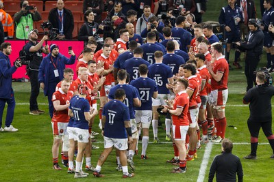 100324 - Wales v France - Guinness Six Nations - Wales clap France off the pitch at the end of the match