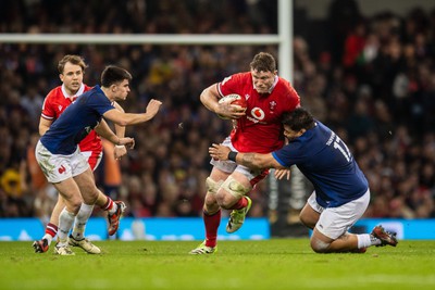 100324 - Wales v France - Guinness Six Nations - Will Rowlands of Wales is tackled by Sebastien Taofifenua of France