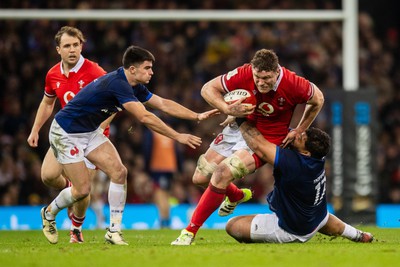 100324 - Wales v France - Guinness Six Nations - Will Rowlands of Wales is tackled by Sebastien Taofifenua of France