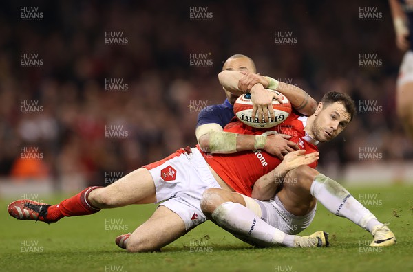 100324 - Wales v France - Guinness 6 Nations Championship - Tomos Williams of Wales is tackled by Gael Fickou of France 