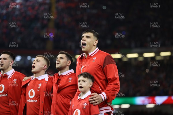 100324 - Wales v France - Guinness 6 Nations Championship - Dafydd Jenkins of Wales sings the anthem