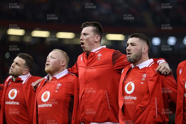 100324 - Wales v France - Guinness 6 Nations Championship - Adam Beard of Wales sings the anthem