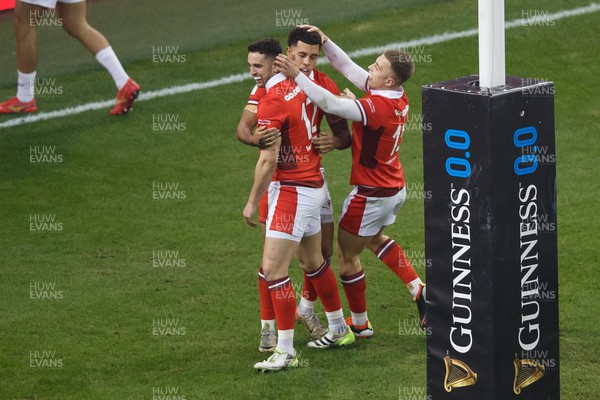 100324 - Wales v France - Guinness Six Nations - Rio Dyer of Wales is congratulated after scoring a try