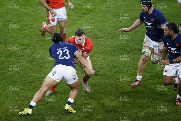 100324 - Wales v France - Guinness Six Nations - Mason Grady of Wales is tackled by Yoram Moefana of France
