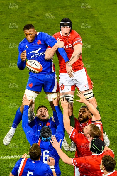 110322  - Wales v France - Guinness Six Nations  - Cameron Woki of France and Adam Beard of Wales jump for the line out ball 