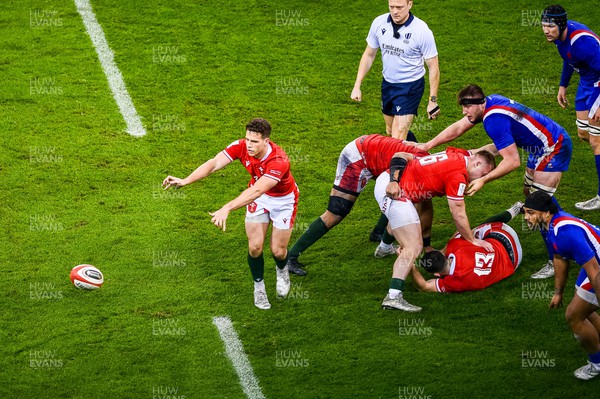 110322  - Wales v France - Guinness Six Nations  - Kieran Hardy of Wales passes the ball out 