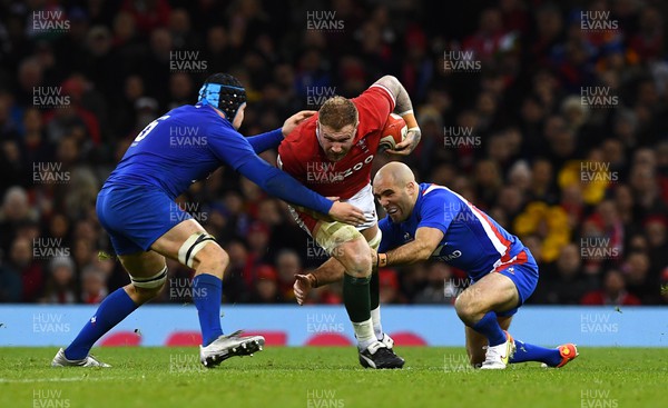 110322 - Wales v France - Guinness Six Nations - Ross Moriarty of Wales is tackled by Francois Cros and Maxime Lucu of France