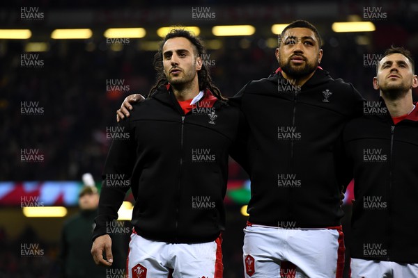 110322 - Wales v France - Guinness Six Nations - Josh Navidi and Taulupe Faletau of Wales during the anthems