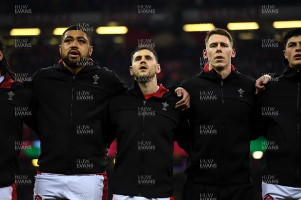 110322 - Wales v France - Guinness Six Nations - Taulupe Faletau, Tomos Williams, Liam Williams of Wales during the anthems