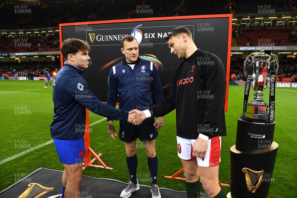 110322 - Wales v France - Guinness Six Nations - Antoine Dupont of France, Referee Matthew Carley and Dan Biggar of Wales during the coin toss