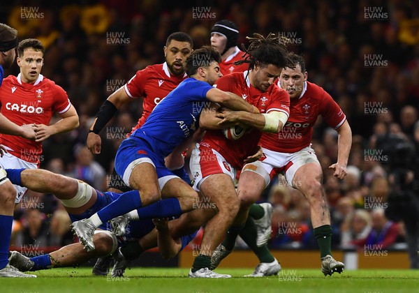 110322 - Wales v France - Guinness Six Nations - Josh Navidi of Wales is tackled by Romain Ntamack of France