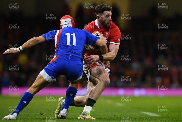 110322 - Wales v France - Guinness Six Nations - Alex Cuthbert of Wales is tackled by Gabin Villiere of France